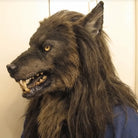 Brown werewolf mask with fangs and mane, worn by a person | Chaps London