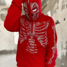 Red rhinestone skeleton hoodie with skull mask hood, worn by person outdoors | Chaps London