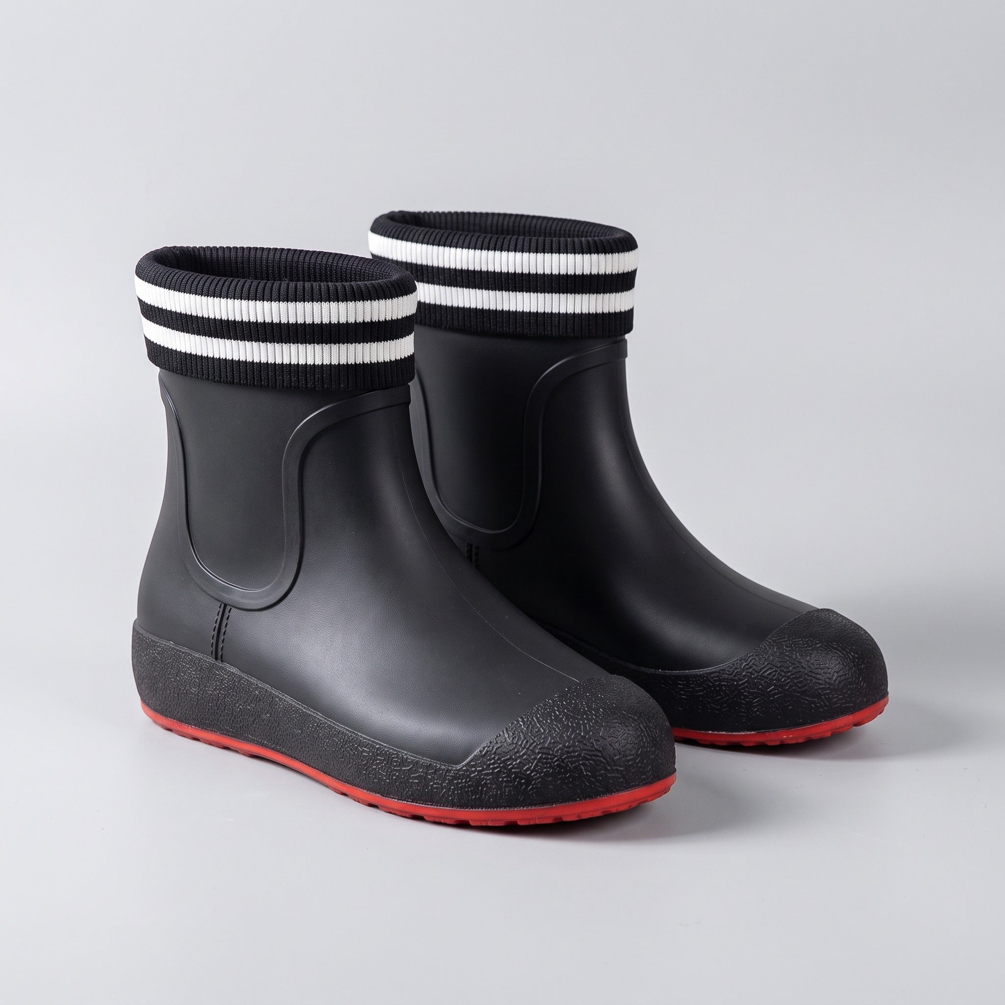 Black ankle wellies with striped cuffs and red soles, shown unworn | Chaps London