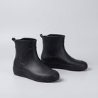 Pair of black ankle wellies shown standing on plain background | Chaps London