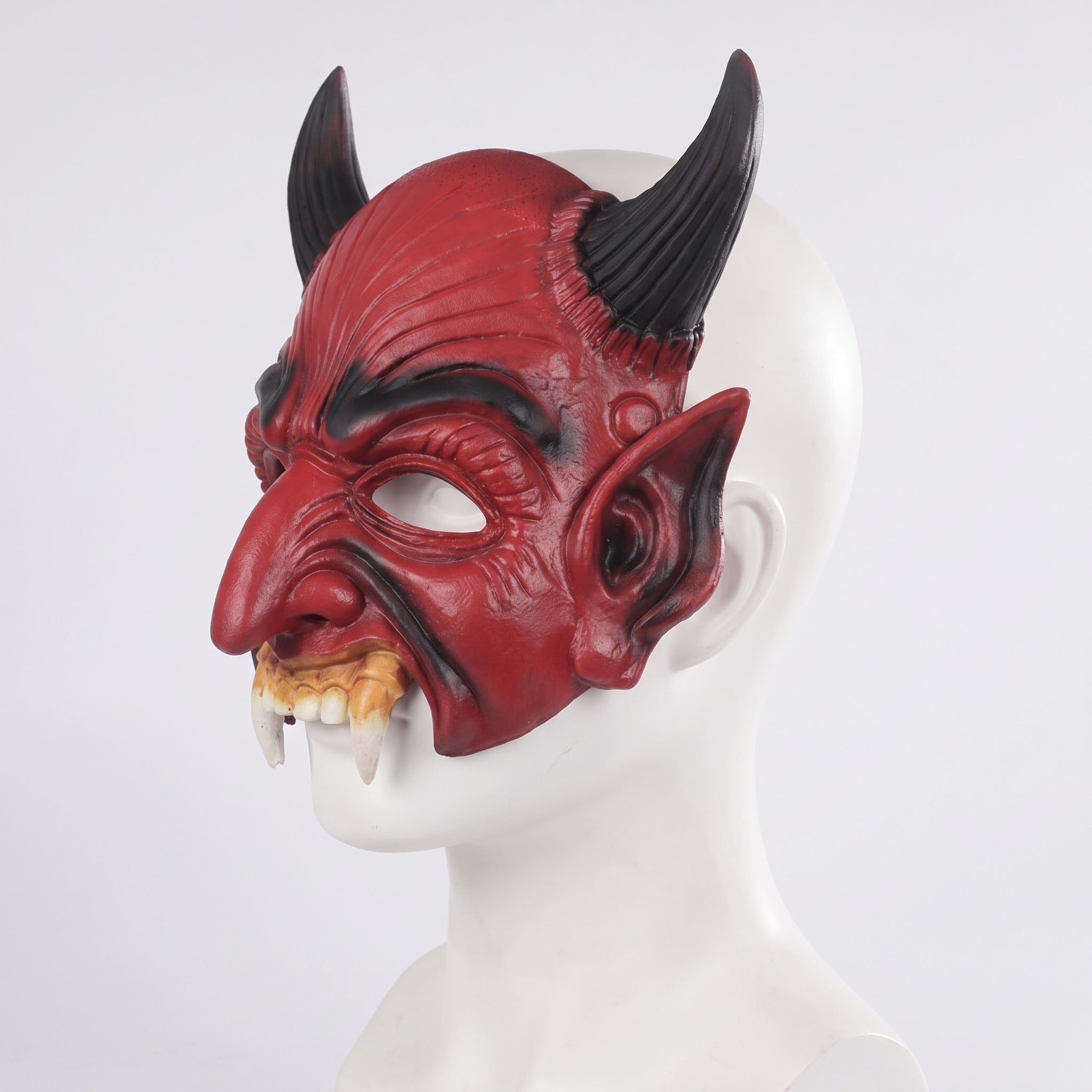 Red devil half mask with black horns on mannequin head | Chaps London