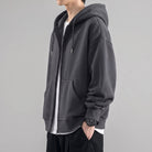 Gray oversized zip hoodie worn by man, side view, drawstring hood | Chaps London