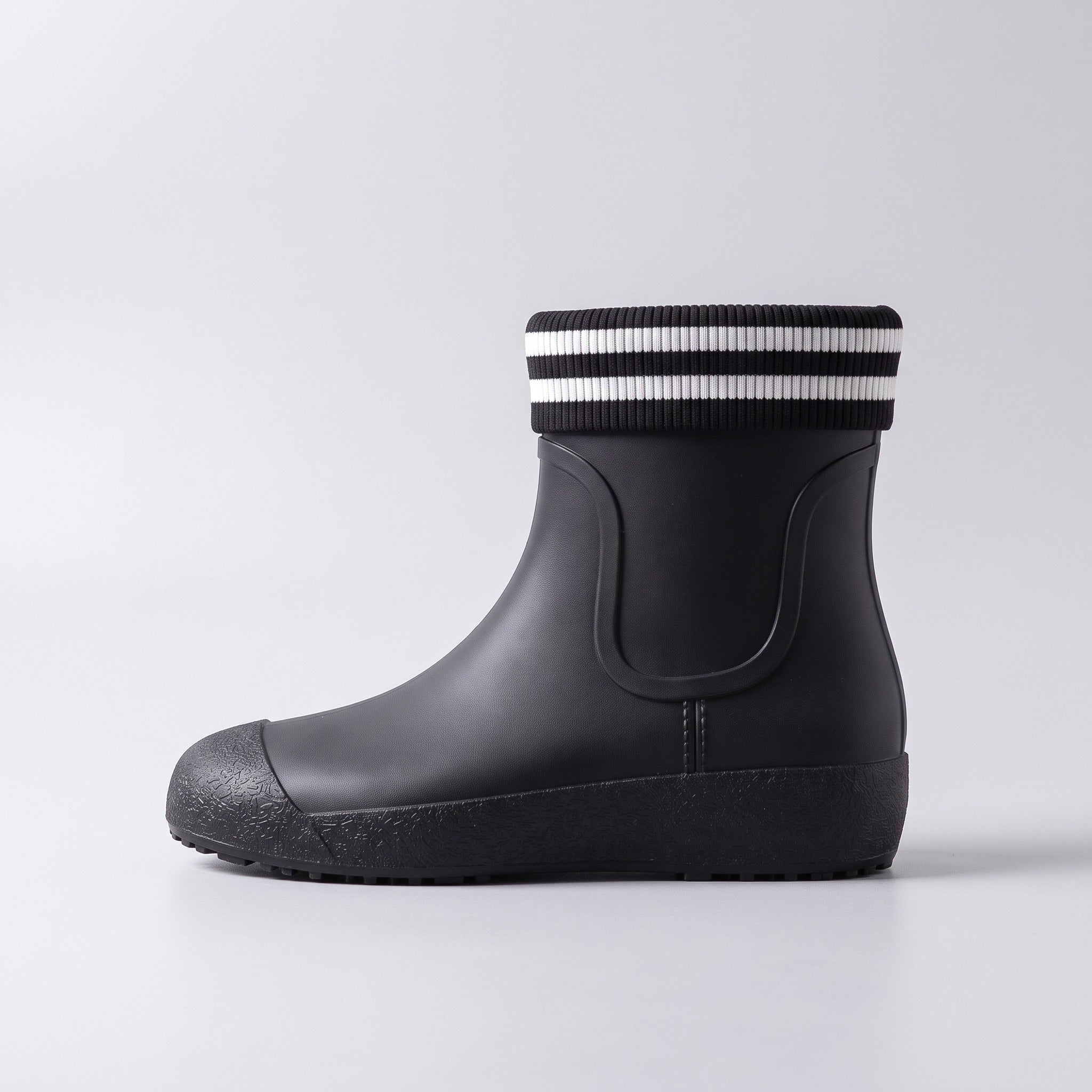 Black ankle wellie boot with striped knit cuff, side view | Chaps London