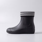 Black ankle wellie boot with striped knit cuff, side view | Chaps London