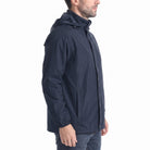 Man wearing navy hooded rain jacket, side profile view, worn | Chaps London