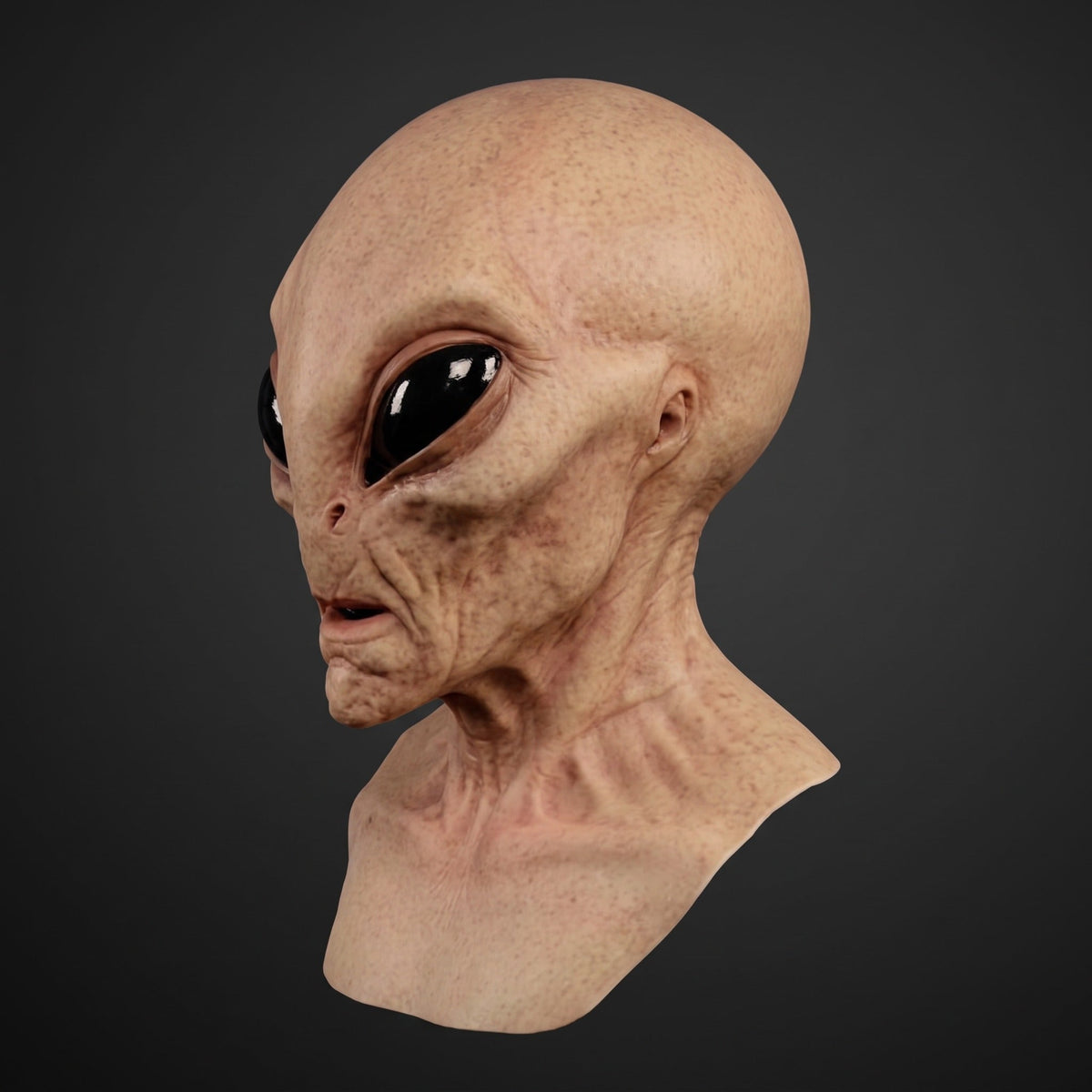 Alien mask with large black eyes, tan skin tone, neck piece shown | Chaps London