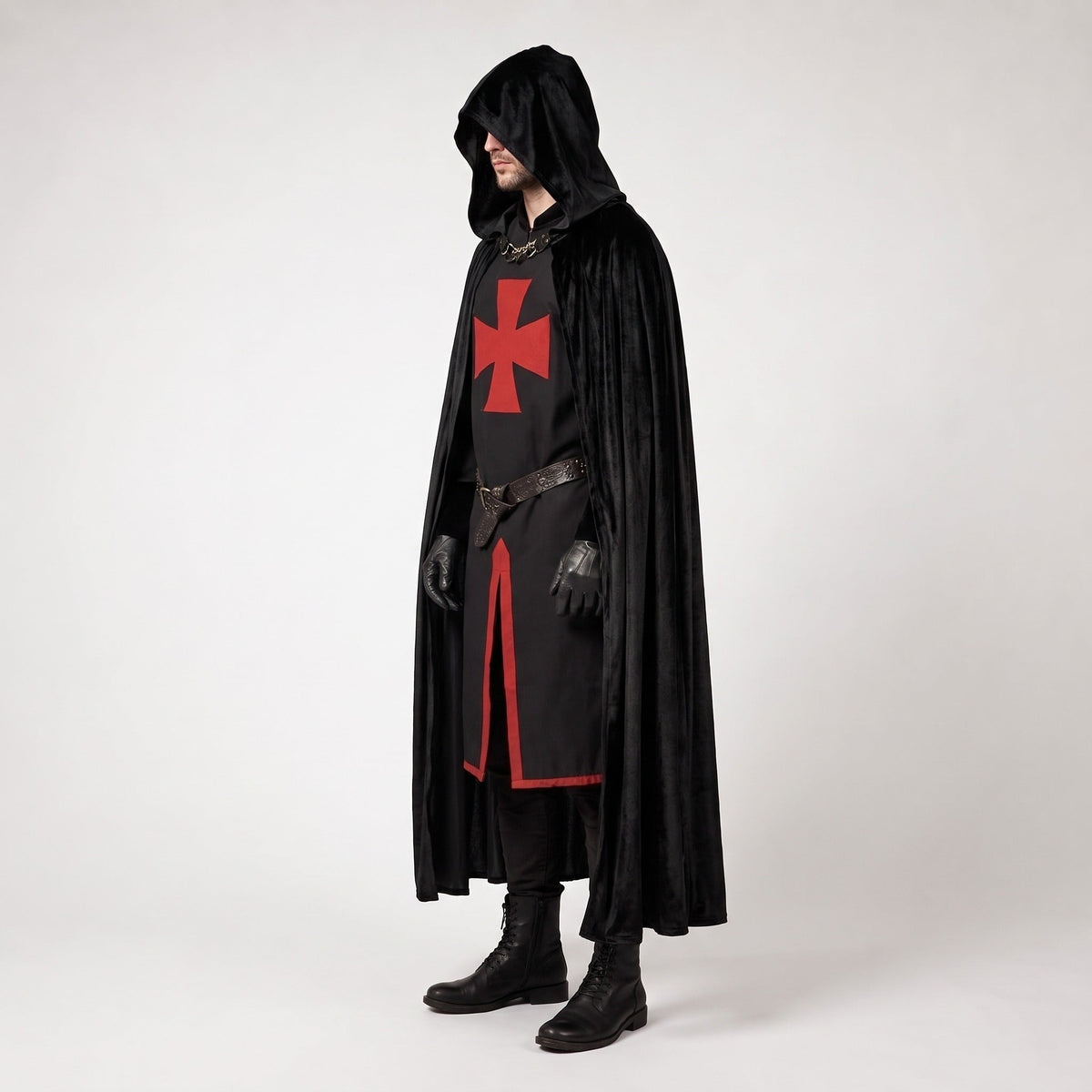 Man wearing black hooded cloak over red cross tunic costume | Chaps London