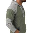 Man wearing green and grey lace-up hoodie with raglan sleeves, side view | Chaps London