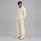 Man wearing cream cable-knit collared top with matching wide-leg trousers | Chaps London