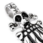 Silver skull and skeleton hand pendant with black accents, shown flat | Chaps London