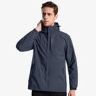 Man wearing slate blue hooded rain jacket with zippered pockets, front view | Chaps London
