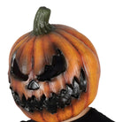 Orange pumpkin mask with evil jack-o-lantern face worn by person | Chaps London