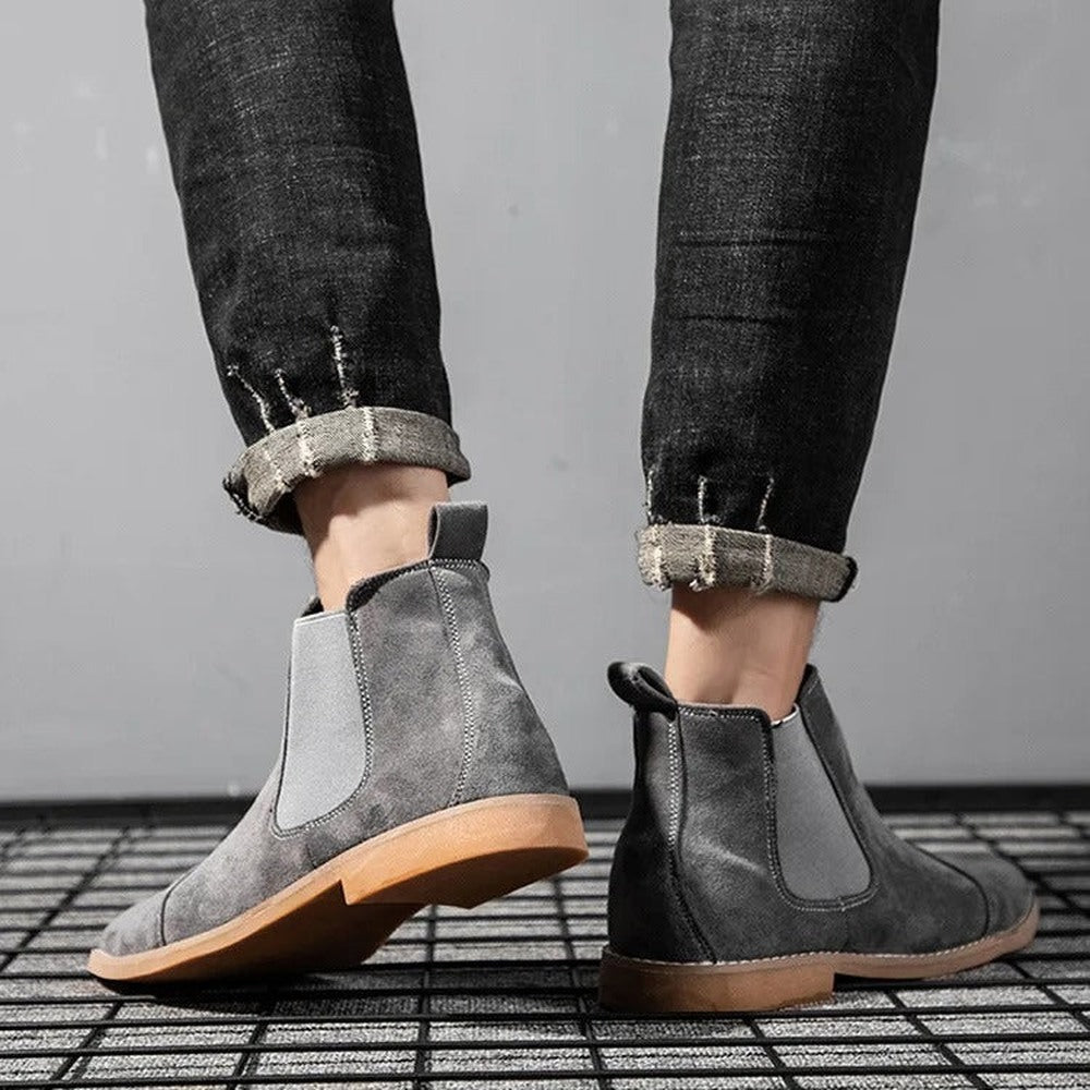 Gray faux suede Chelsea boots worn on feet with rolled cuffed jeans | Chaps London