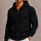 Black full-zip fleece hoodie with drawstring hood worn by a man | Chaps London
