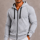 Man wearing grey zip-up hoodie with drawstring hood and front pocket | Chaps London