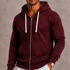 Man wearing burgundy zip-up hoodie with white drawstrings, unzipped over bare chest | Chaps London