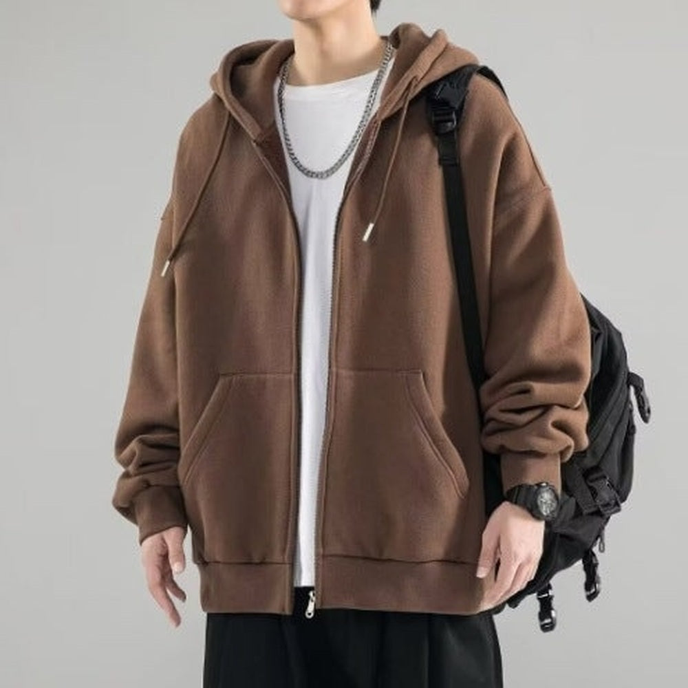 Brown oversized zip hoodie worn by man with chain necklace and backpack | Chaps London