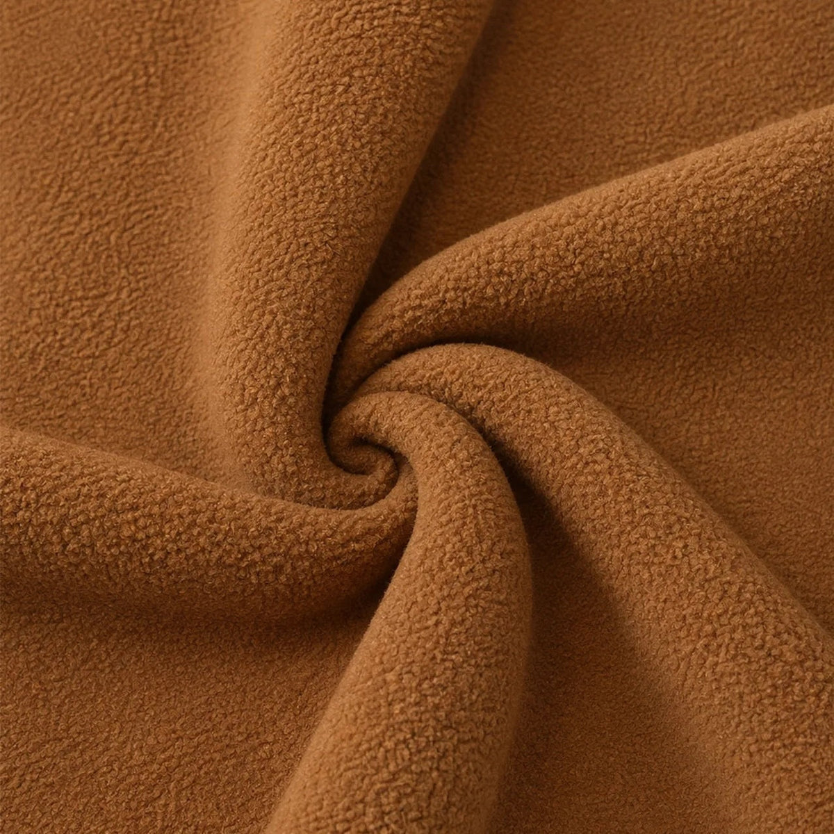 Camel brown fleece fabric swatch twisted into spiral pattern, close-up texture | Chaps London