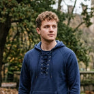 Man wearing navy lace-up collar hoodie with kangaroo pocket outdoors | Chaps London