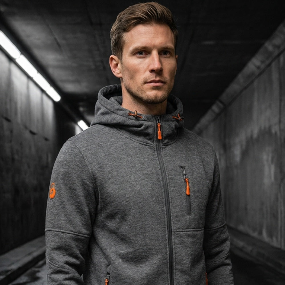 Man wearing dark grey zip hoodie with orange zipper pullers, hood up | Chaps London