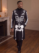 Man walking in the long black skeleton print costume coat