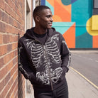 Man wearing the skeleton zip hoodie on a street in Peckham, South London