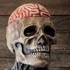 Gray skull mask with exposed brain top, worn on mannequin | Chaps London